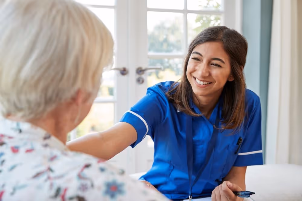 Care nurse looking after an elderly woman