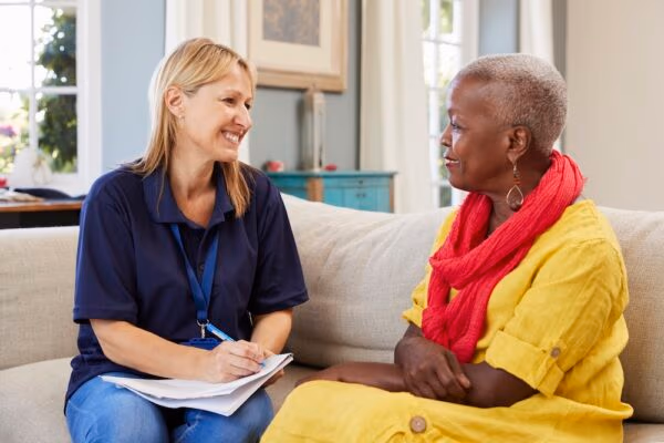 support worker conducting home visit risk assessment