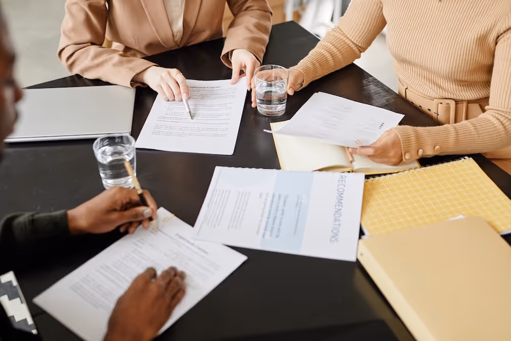 Three professionals reviewing the worker protection act