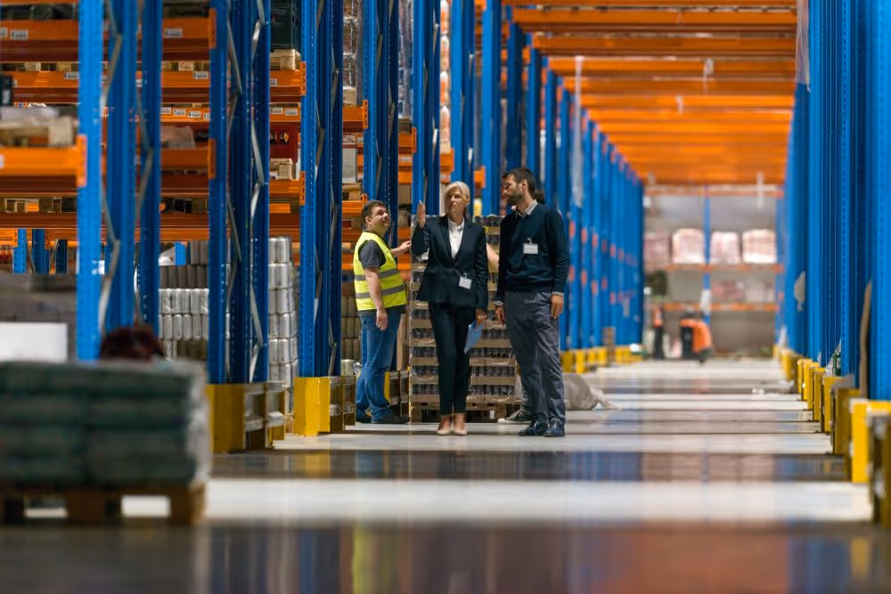 Inspector undertaking site management review in warehouse