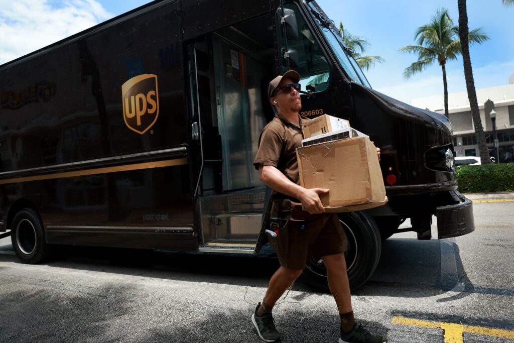 UPS delivery driver delivering a package