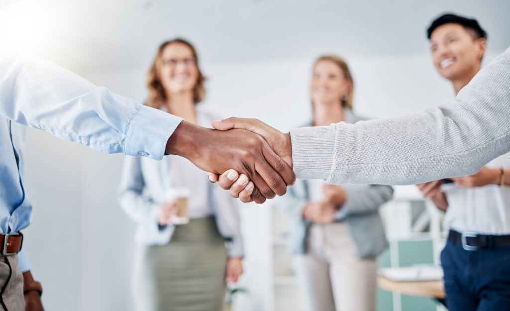 Business people shaking hands for partnership and collaboration