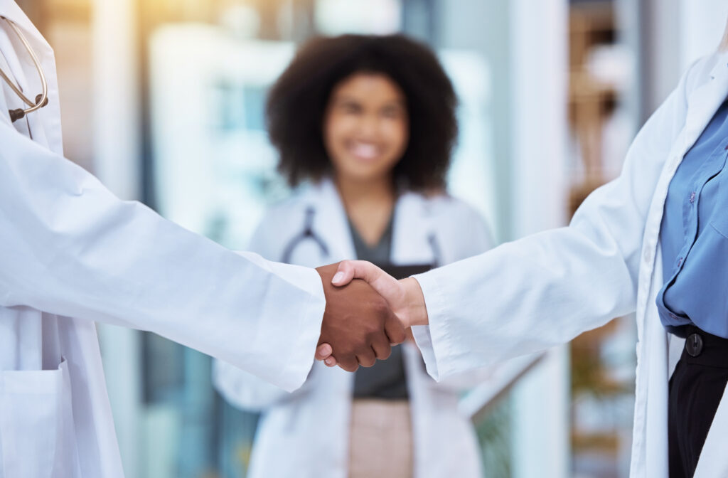 Healthcare staff shaking hands