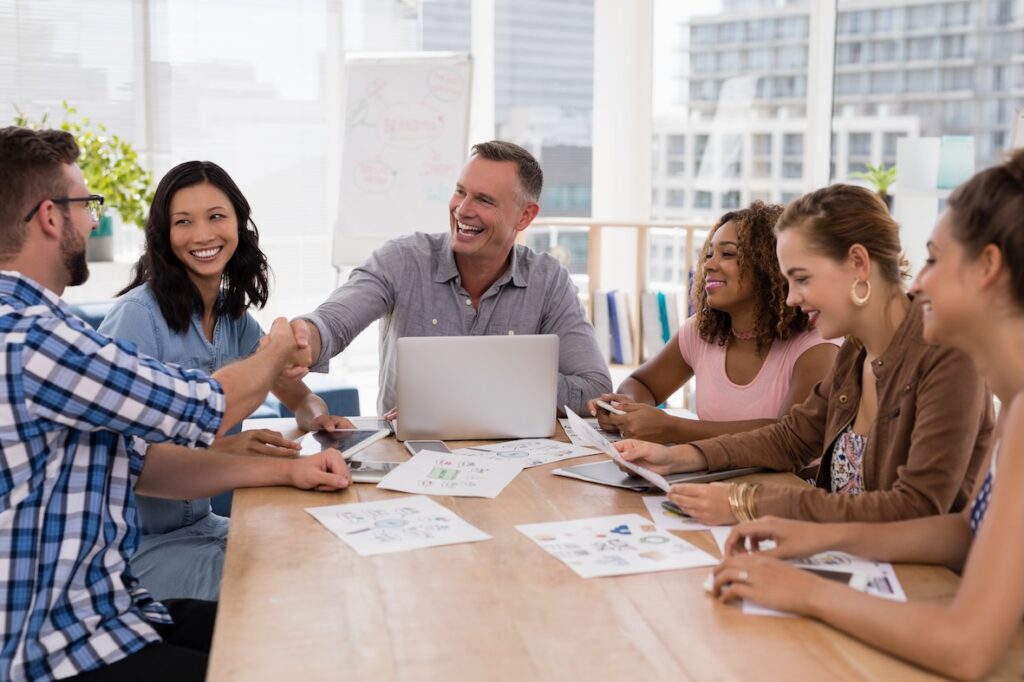 smiling team in meeting